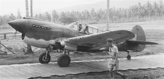 "Bluey" Truscott, 76 Squadron RAAF in his P-40E Kittyhawk A29-142 in New Guinea in 1942